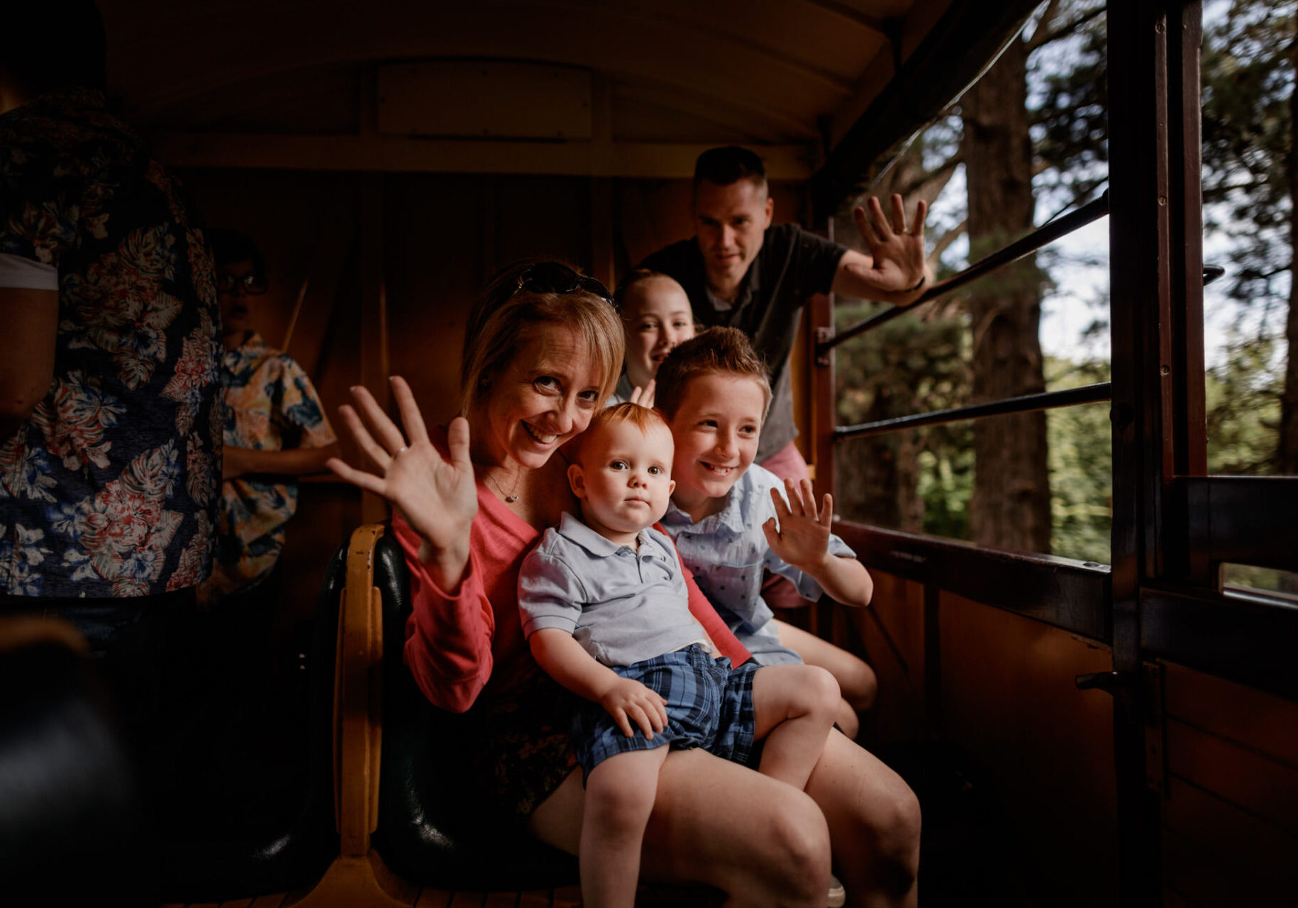 Young Family Waving Onboard